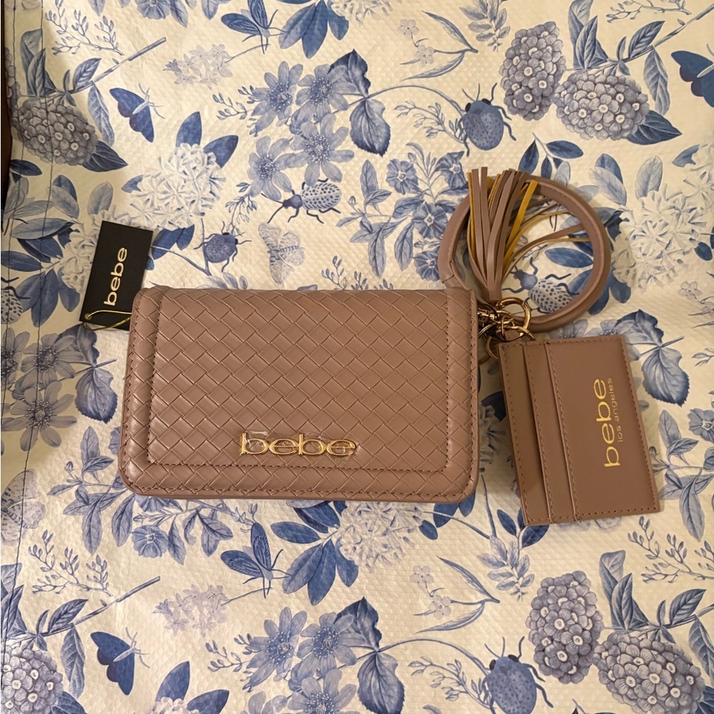 Bebe dusty rose detachable strap bag with wrist band as well snap close , zipper